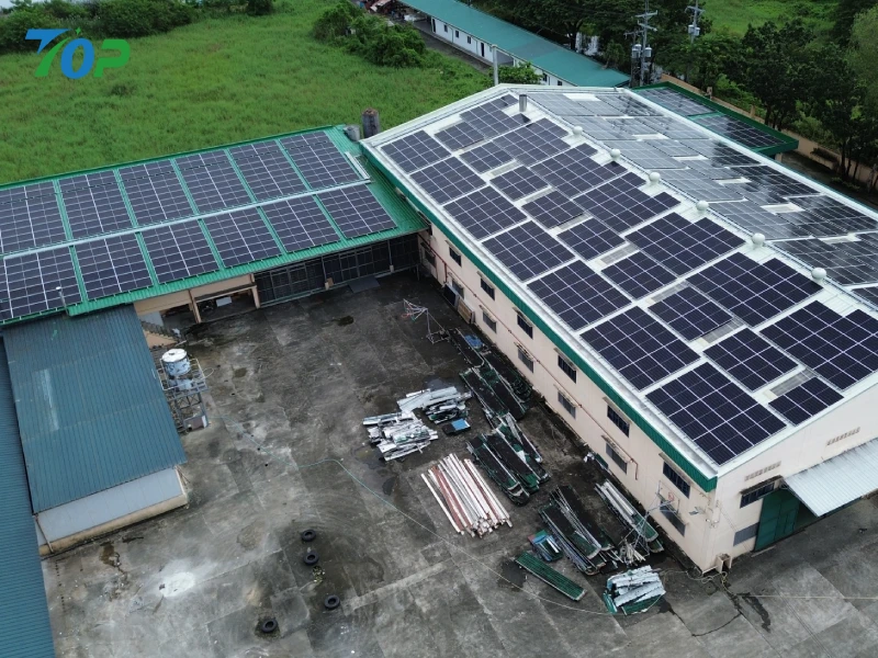 Commercial solar racking system installed on an industrial factory metal roof in Manila.